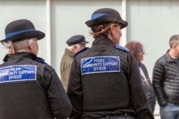 Back of two female police community support officers