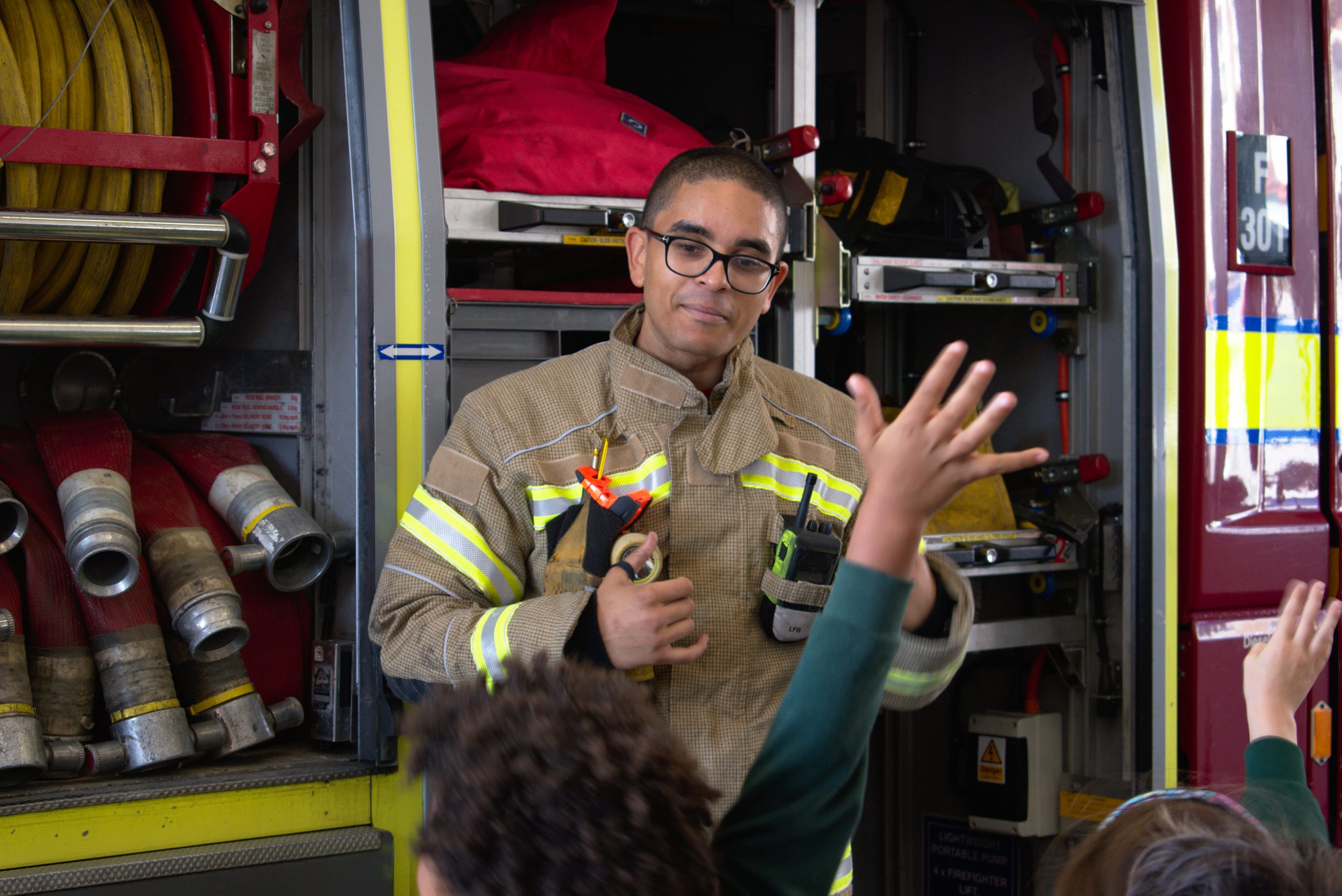 Firefighter teaching children