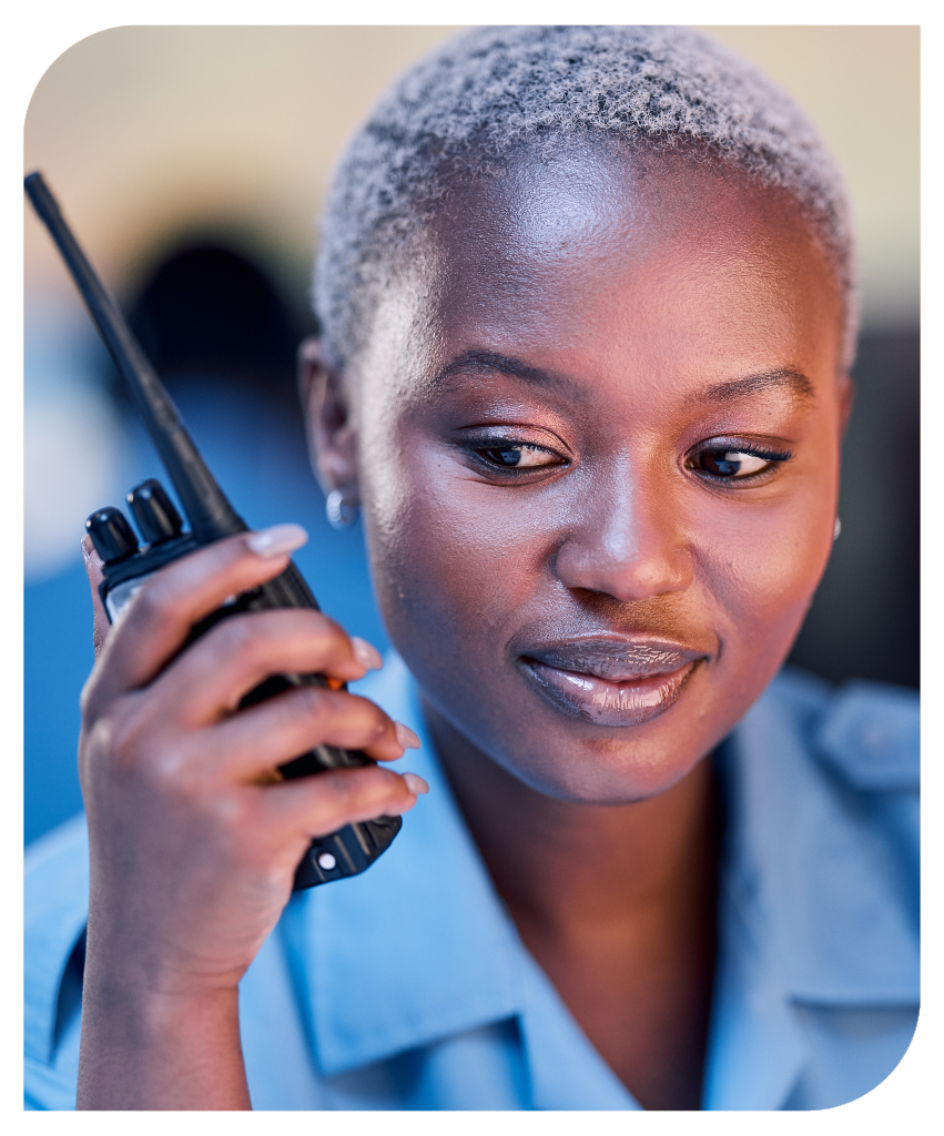 Female security guard using walkie talkie